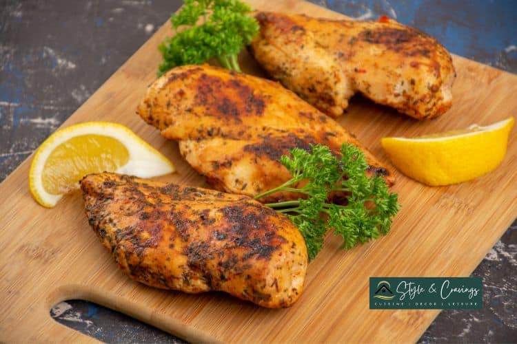 Smoked chicken breast on a wood plate